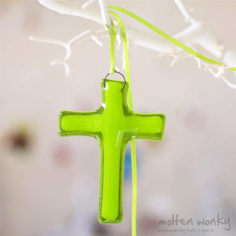 fused glass cross with an aura of colour from molten wonky