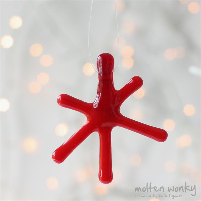 Red Opaque fused glass star hanging decoration made by molten wonky